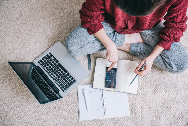 Person sitting on floor wondering how to clean up my credit