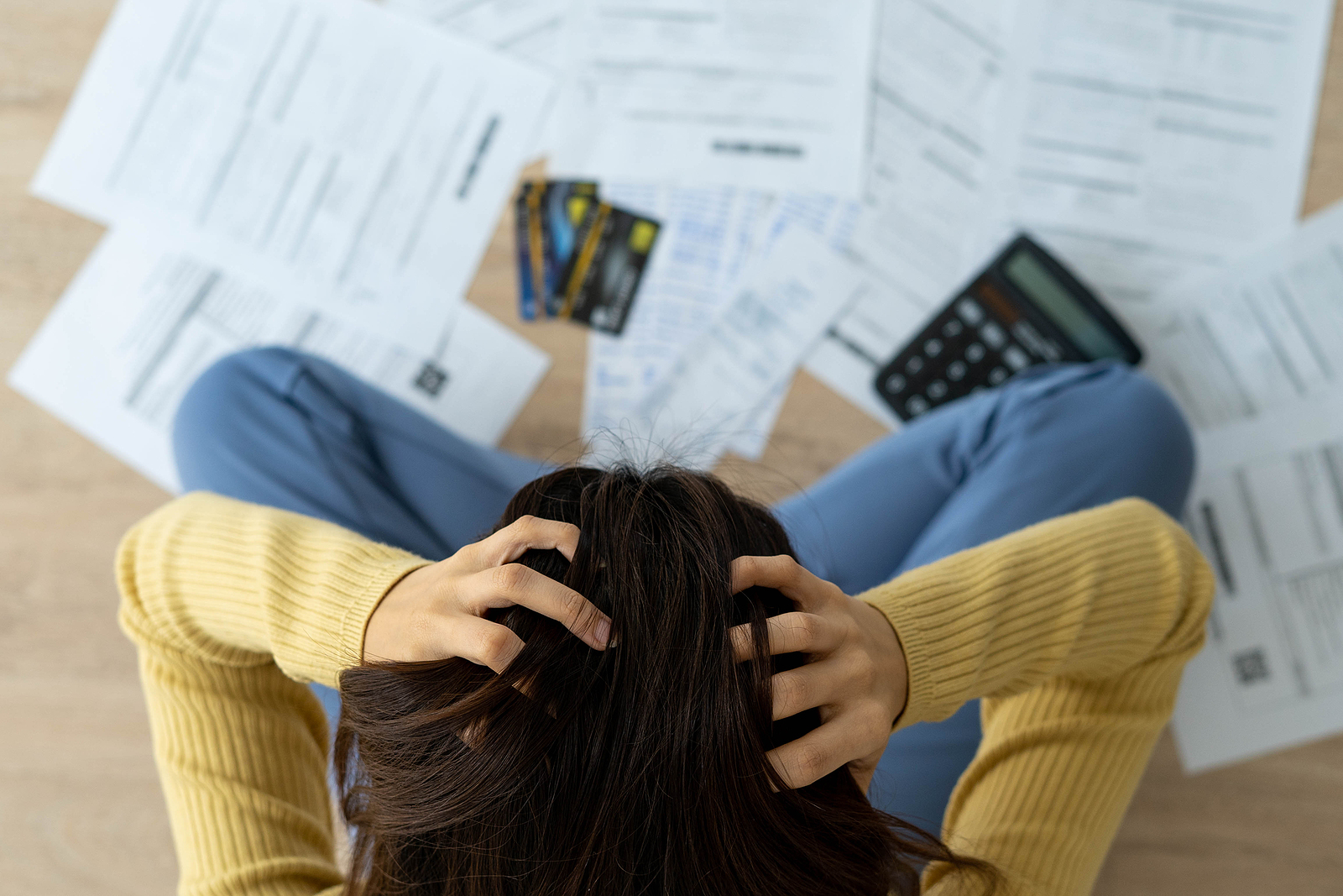 Women Stress About A Lot Of Credit Card Debt And Bills On The Floor