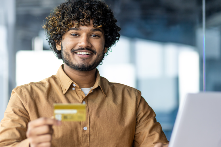 Portrait of young successful hispanic businessman inside office learning what is credit insurance, man smiling and looking at camera