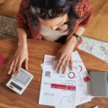 Woman calculating financial bill what is a good debt-to-income ratio at home